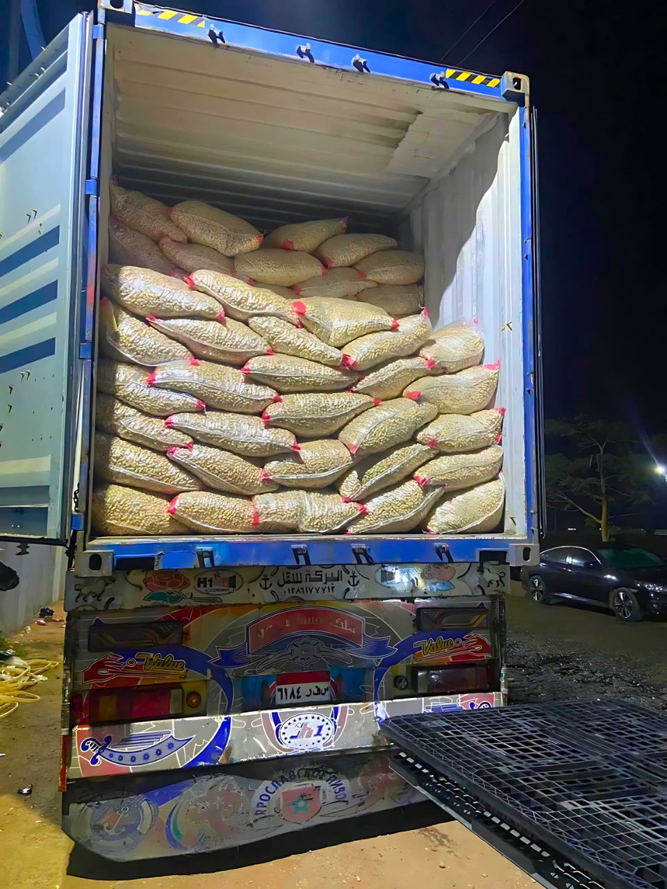 Crops Sacks of goods loaded in a shipping container on a truck. Exporter